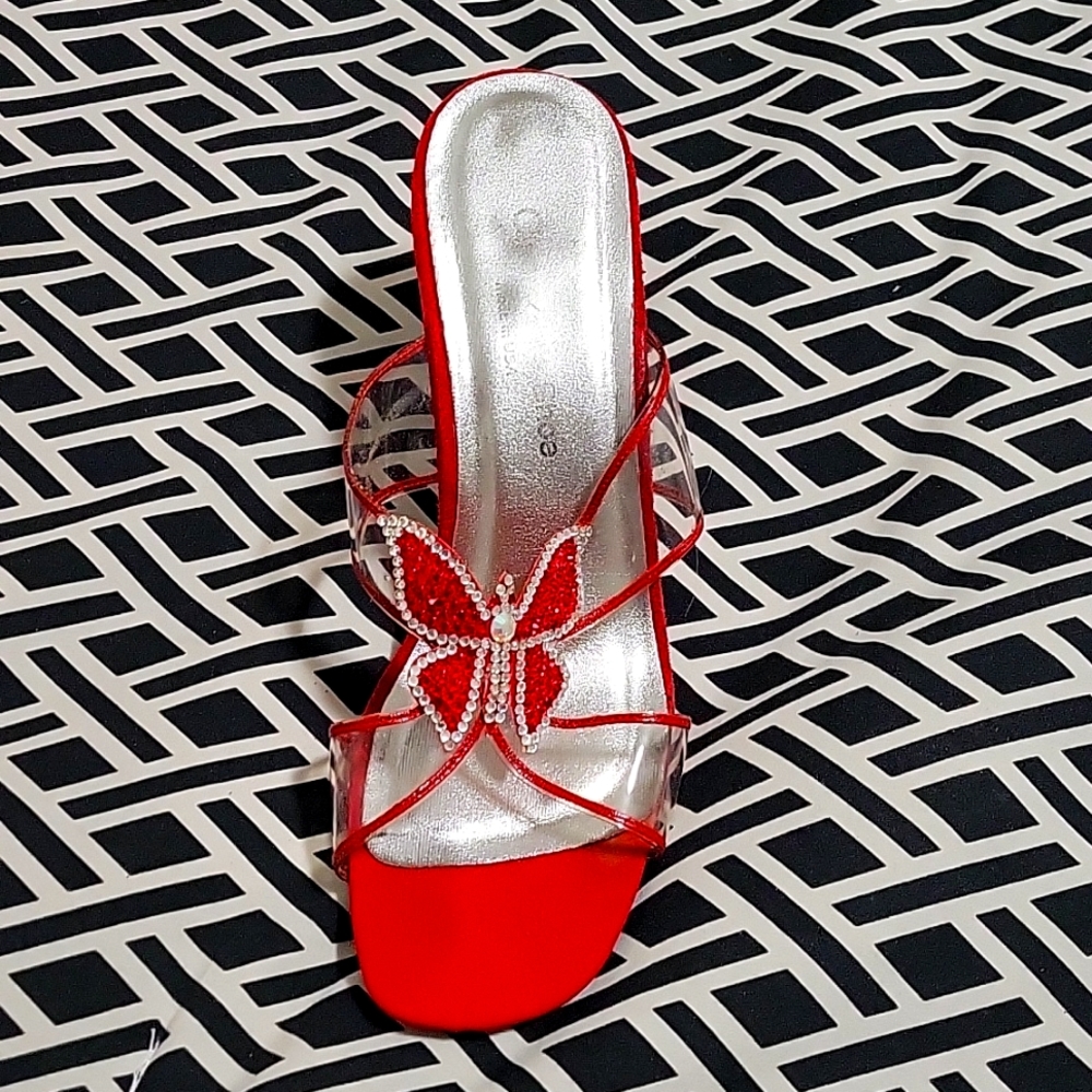 Red butterfly heel gently worn